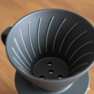 Close-up view of the interior ceramic coffee pour over cone, showing the precise ribbing design for optimal water flow and extraction.